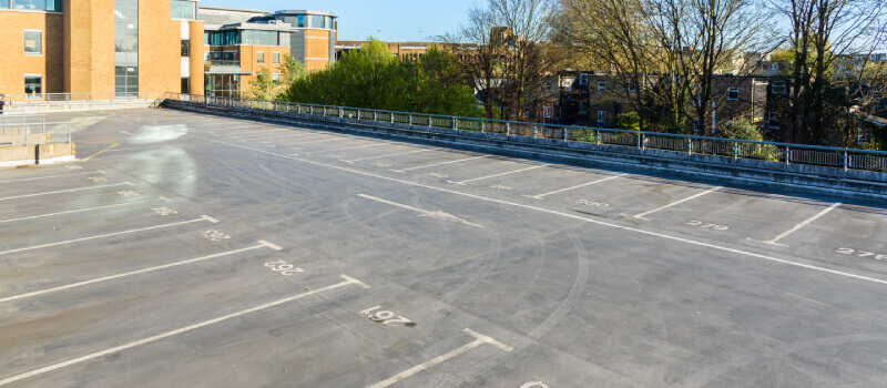 Empty car park with marked bays on the ground