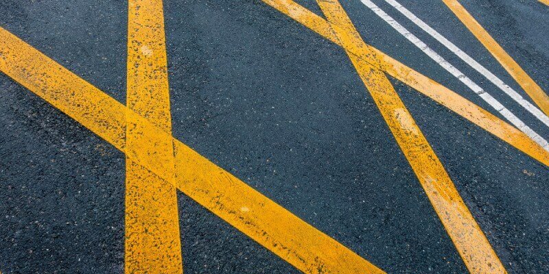 Yellow crossed lines painted onto road