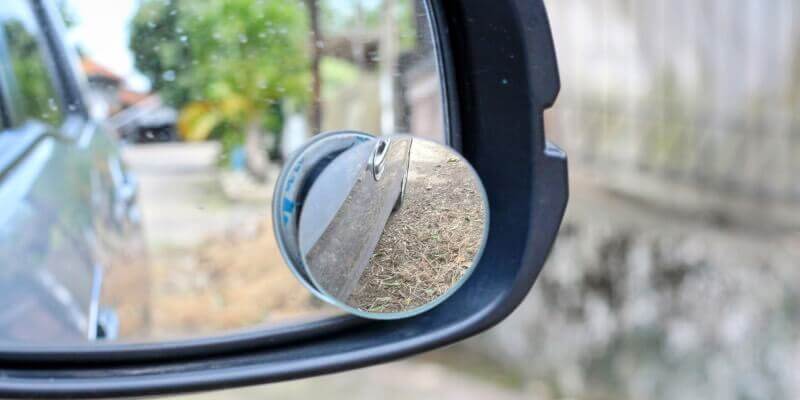 Blind spot mirror attached to wing mirror for wider view