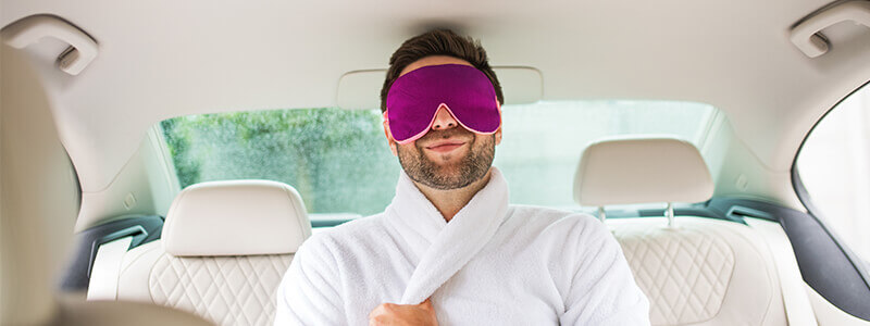 man wearing dressing gown in car