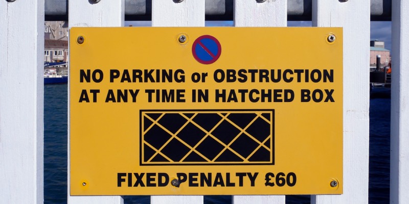 Parking sign advising no parking or stopping in an area