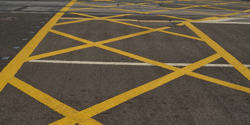 Painted yellow crossed lines on ground